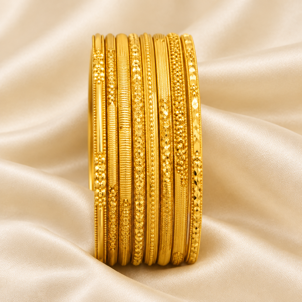 Exact-design eight-piece gold bangle set on ivory silk