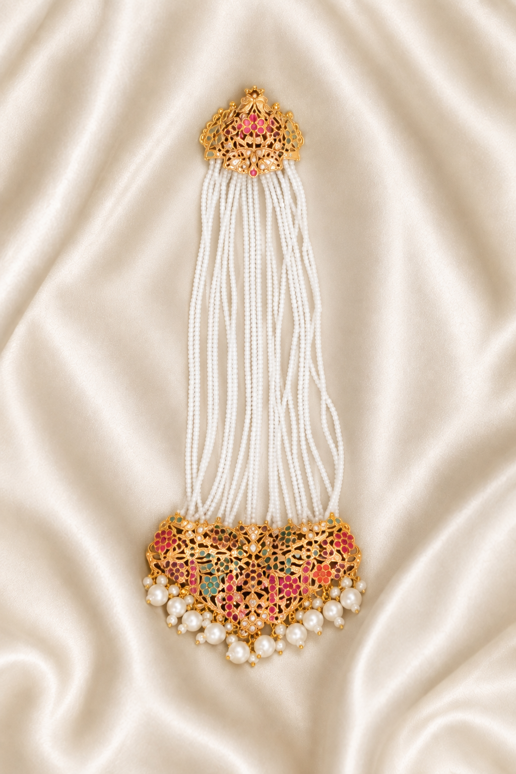 Jewellery rotated 180 degrees on ivory silk