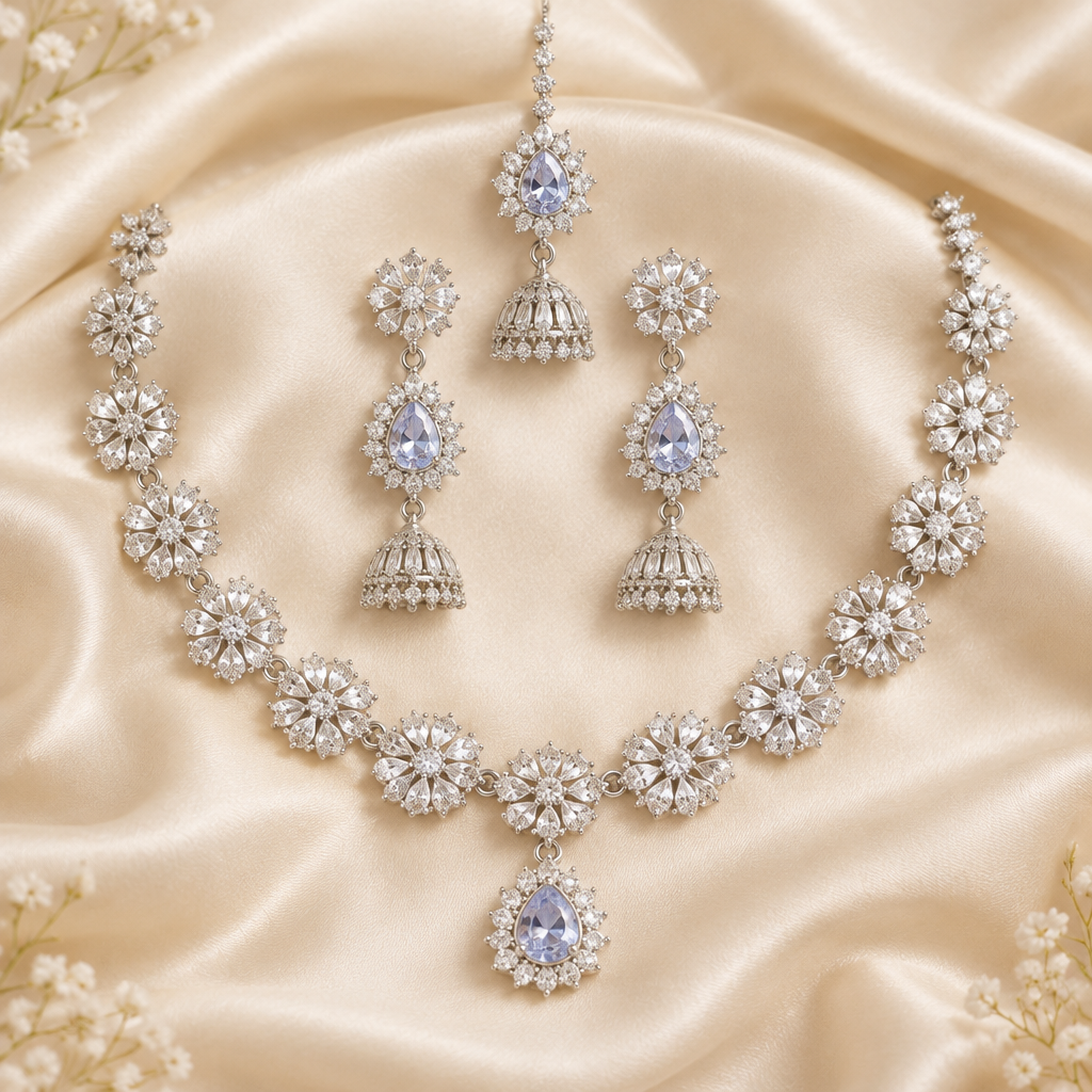 Premium silver jewelry set on ivory silk